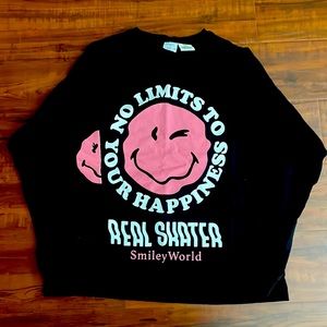 Selling a Zara sweater, colors are black and pink. With white writing on it.